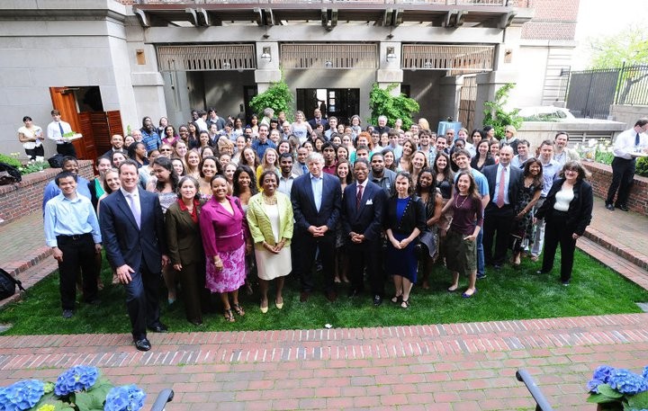 Community Impact Alumni Organization event image: everyone smiling outside